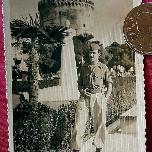 Vintage black and white photo of Greek soldier at White Tower Thessaloniki 1949