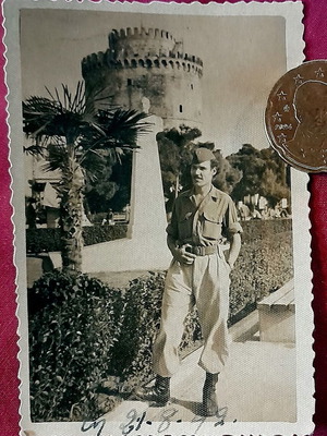 Vintage black and white photo of Greek soldier at White Tower Thessaloniki 1949
