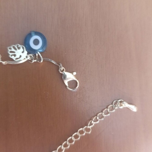 Anklet in gold color with two blue eye rhinestones