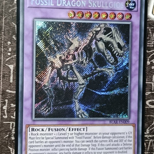 Fossil Dragon Skullgios Yu-Gi-Oh! card with Ultra Pro sleeve and Top Loader