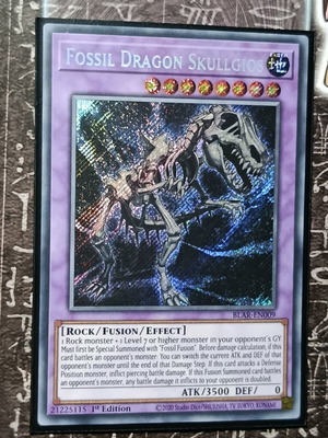 Fossil Dragon Skullgios Yu-Gi-Oh! card with Ultra Pro sleeve and Top Loader