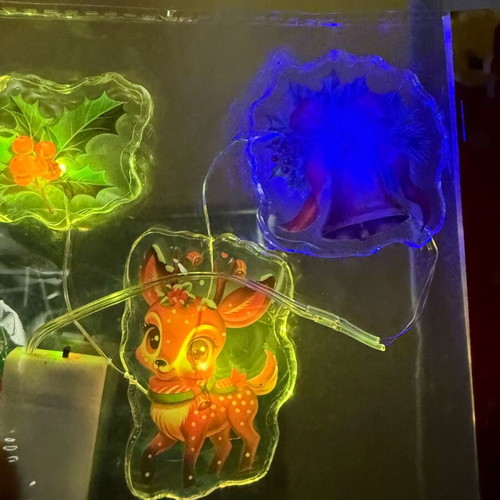 Christmas LED string lights with transparent shapes set new