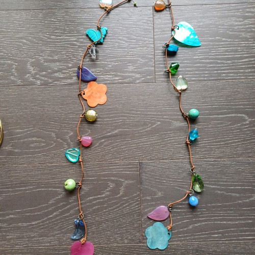 Necklace with leather and various elements used