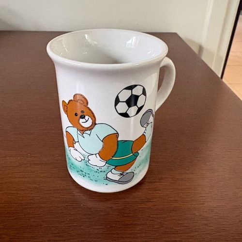 Late 80s children's cup with teddy bear playing football like new