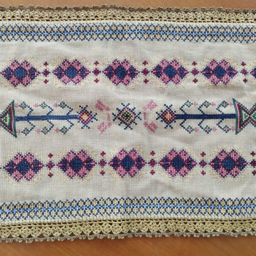 Vintage handmade embroidered table linens with cross-stitch and gold thread