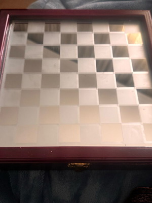Glass decorative chessboard like new with pieces, one broken