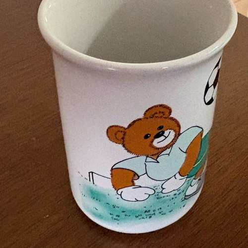 Late 80s children's cup with teddy bear playing football like new