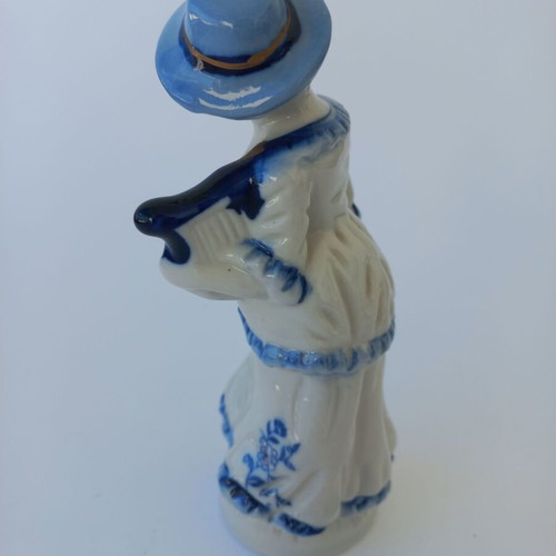 Porcelain figurine with girl musician like new
