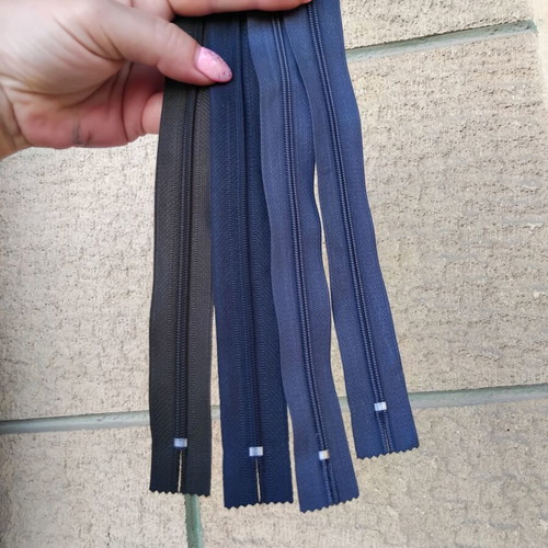Metal and plastic sewing zippers YKK, assorted colors and sizes, pack
