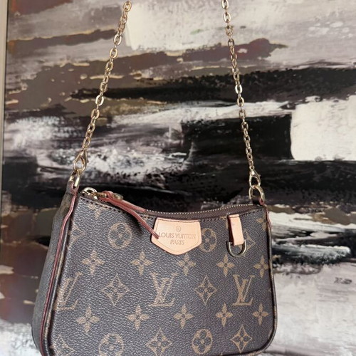 Louis Vuitton small handheld bag, leather, elegant