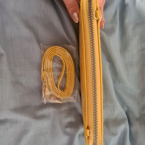 Yellow wallet used with strap