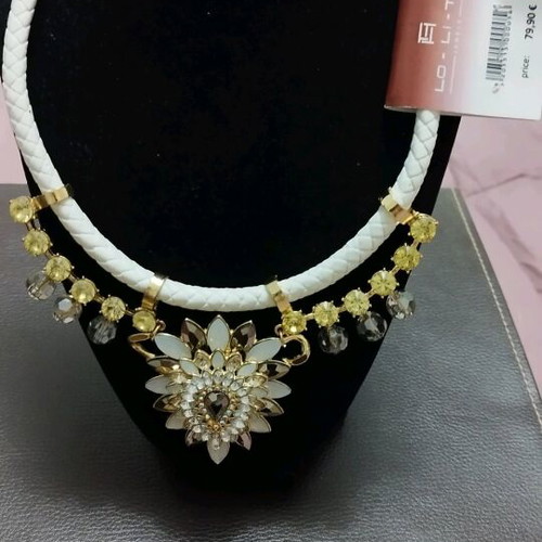 Necklace new with white braid and gold flower details