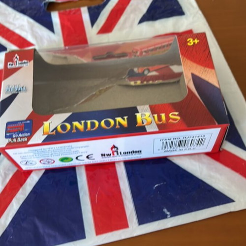 Plastic bag with English flag and small empty London bus box like new