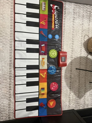 Children's Floor Piano like new with various musical instruments