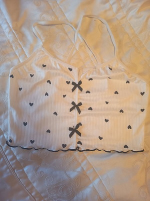 Women's white crop top with black hearts