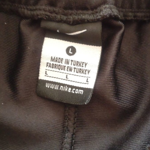 Nike tracksuit with side buttons like new, black and white