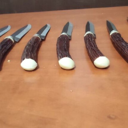 Vintage steak knives set of 9 with faux antler handles like new