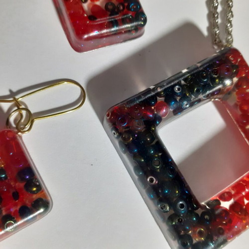 Two sets of handmade pendants and earrings, multicolor