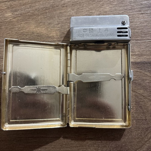 Sunflower lighter used with signs of wear, made in Shanghai
