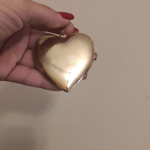 Large heart pendant like new, gold color with photo holder