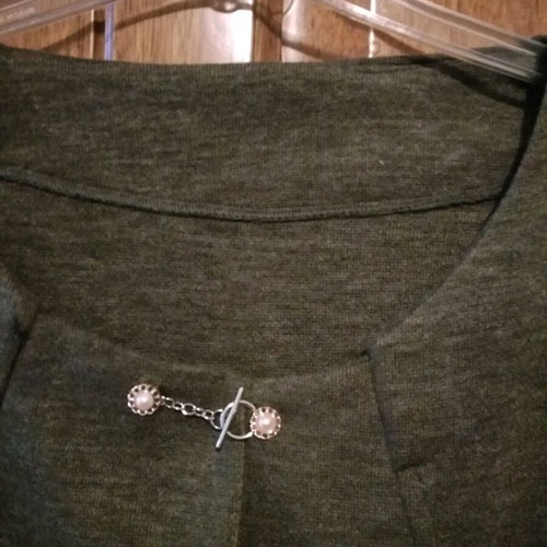 Short cardigan new in olive with gold flower and pearl, size L