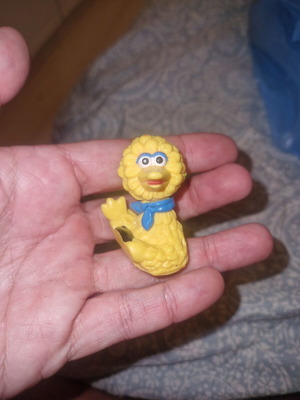 Big Bird figure from Sesame Street with blue scarf