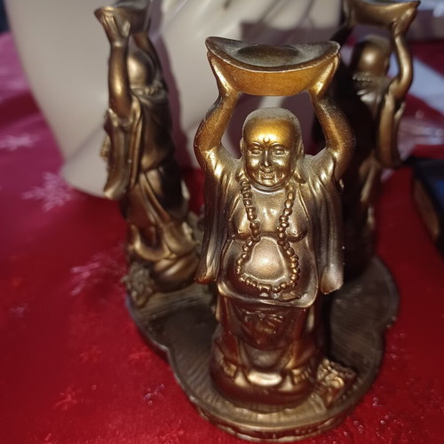 Asian candlestick with 3 smiling figures used, bronze finish