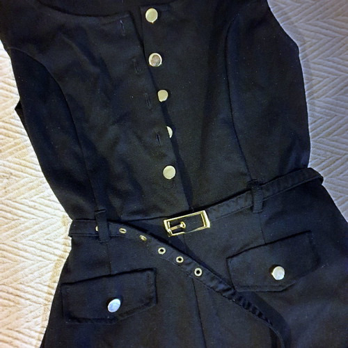 Black short jumpsuit with gold buttons and belt