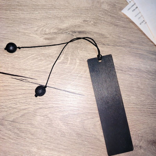 Handmade wooden bookmark with skull design and lava stone beads