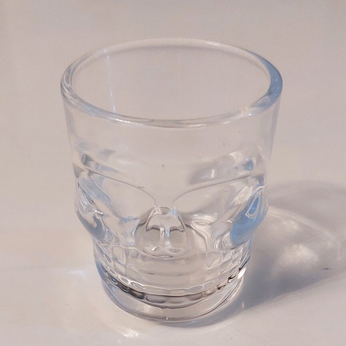 Collectible glass shot glass with 3D skull design like new