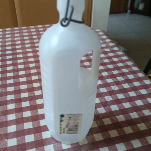 Plastic bottle with safety cap unused