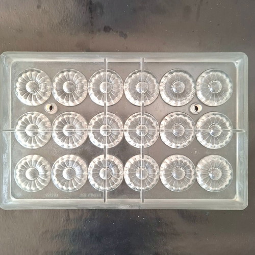 Polycarbonate chocolate mold used, 18 cavities, flower design