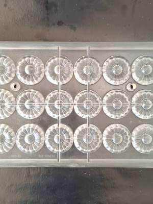 Polycarbonate chocolate mold used, 18 cavities, flower design