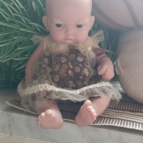 Doll with vintage dress
