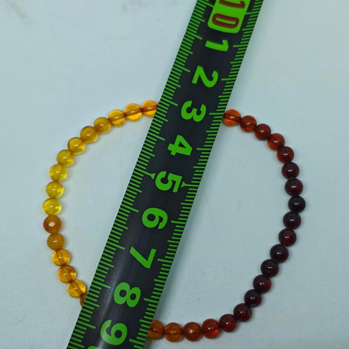 Handmade bracelet from natural amber with color gradient like new