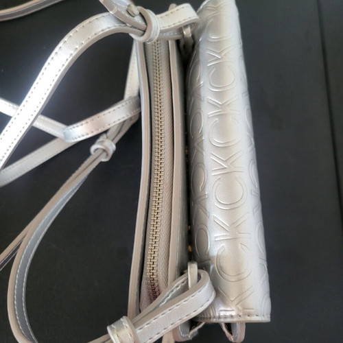 Calvin Klein silver bag like new with logo