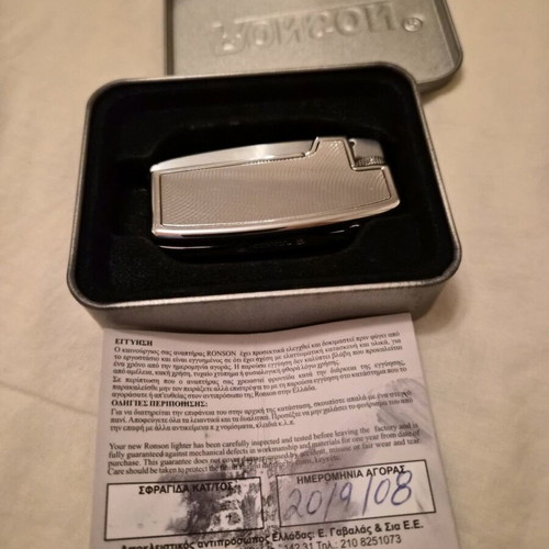 Ronson lighter like new with purchase tag