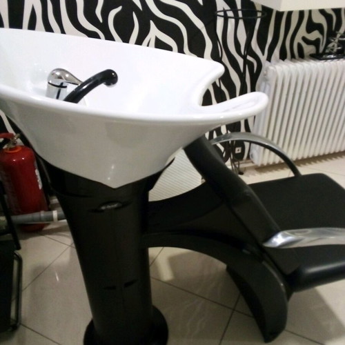Hair salon chair used with leather seat and stainless steel arms