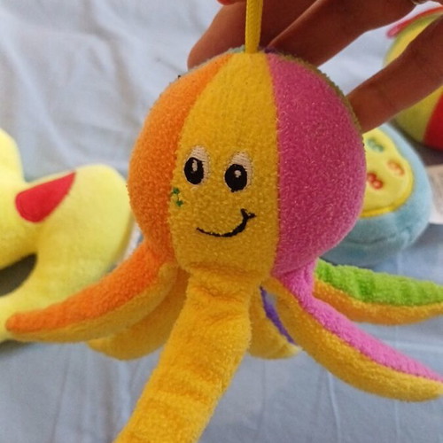 Set of 5 baby toys with octopus, ball, duck, rattle, chicken, and phone