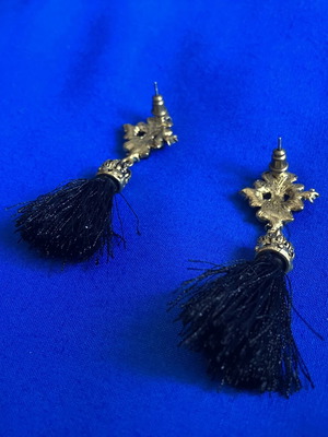 Gold and black earrings with tassel