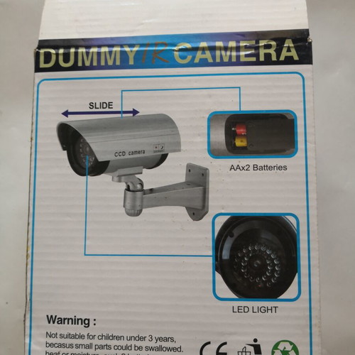 Dummy security camera with flashing red light