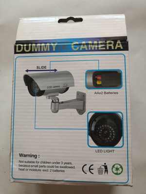 Dummy security camera with flashing red light
