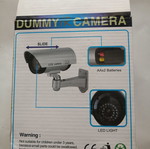 Dummy security camera with flashing red light