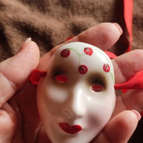 Small decorative masks like new, set of two