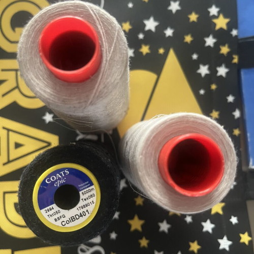 Sewing threads like new, three pieces, two ecru and one black