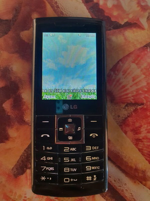 LG S310 mobile phone used, 3.15MP camera, black