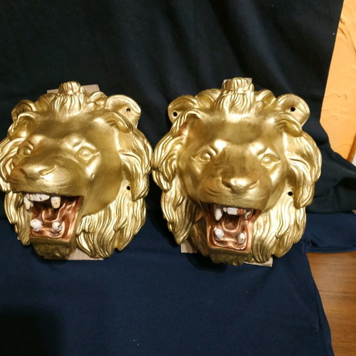 Decorative items used, cast iron lion heads, old antiques