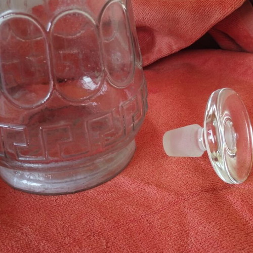 Glass wine carafe used with meander design