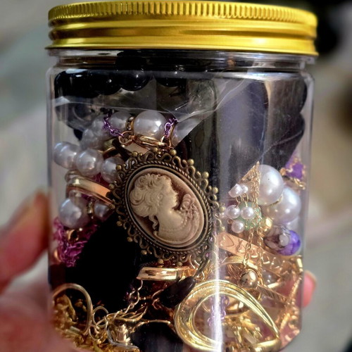 Jar with jewelry, necklaces, rings, bracelets and earrings