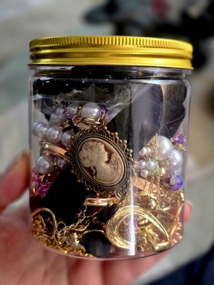 Jar with jewelry, necklaces, rings, bracelets and earrings